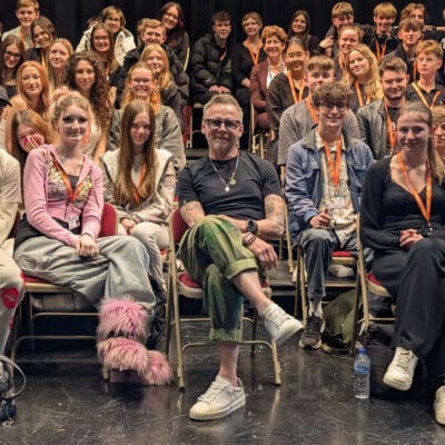 simon pegg sitting in the audience of students