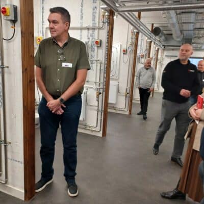 heat pump event with attendees viewing the equipment