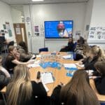 students sat around a table