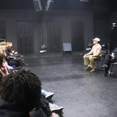 john speaking with students