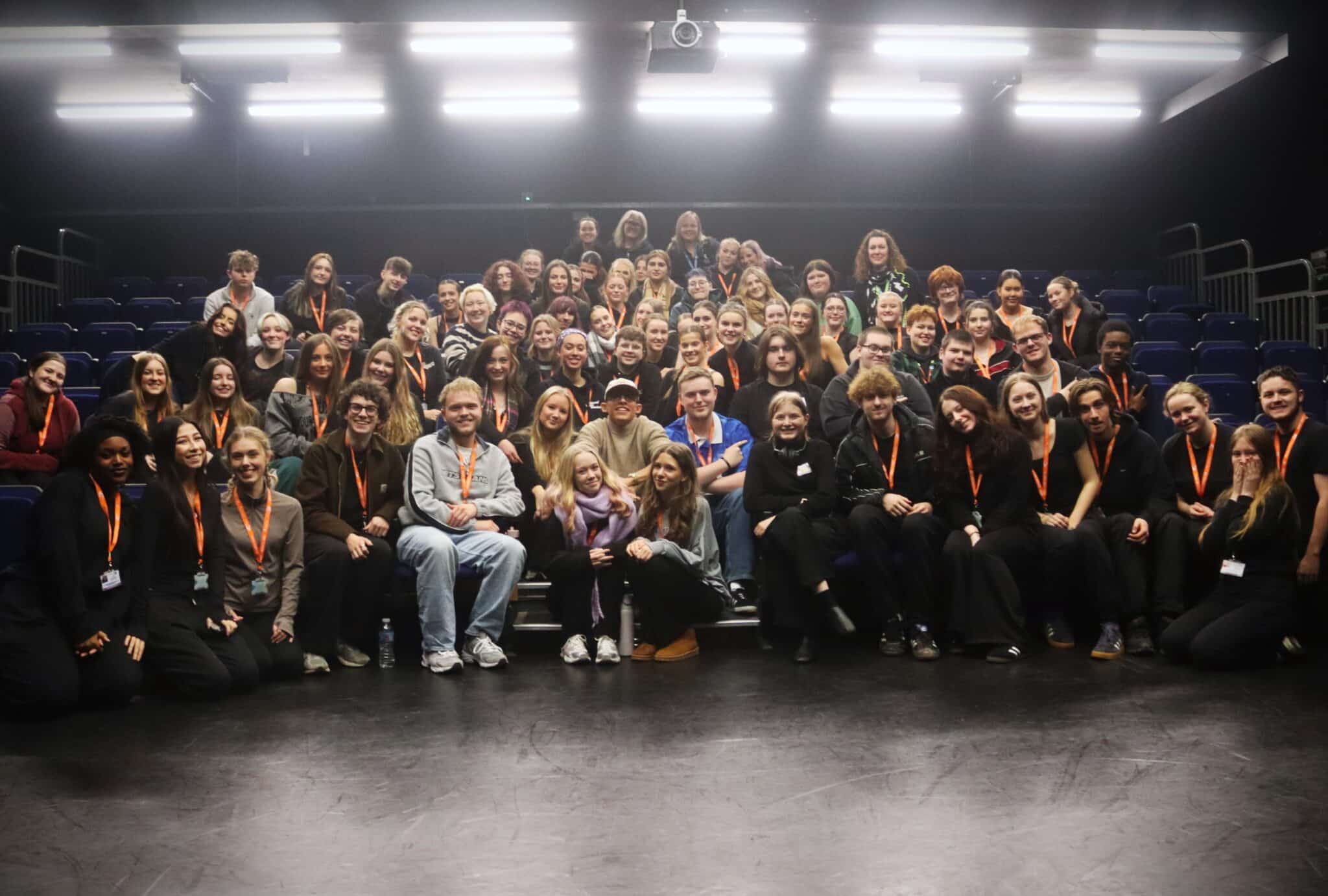 group of students surrounding john leader