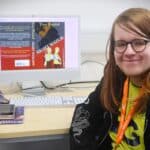 student sat in front of computer