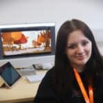 student sat in front of computer screen