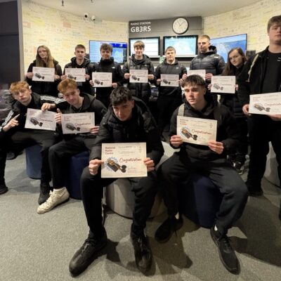 students holding certificates
