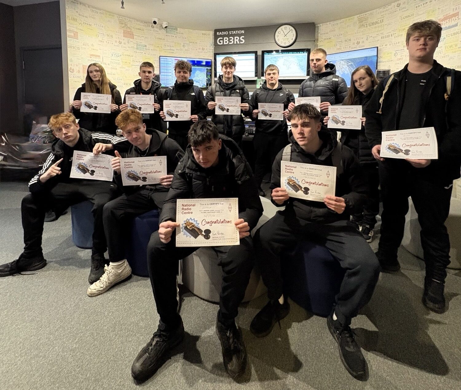 students holding certificates
