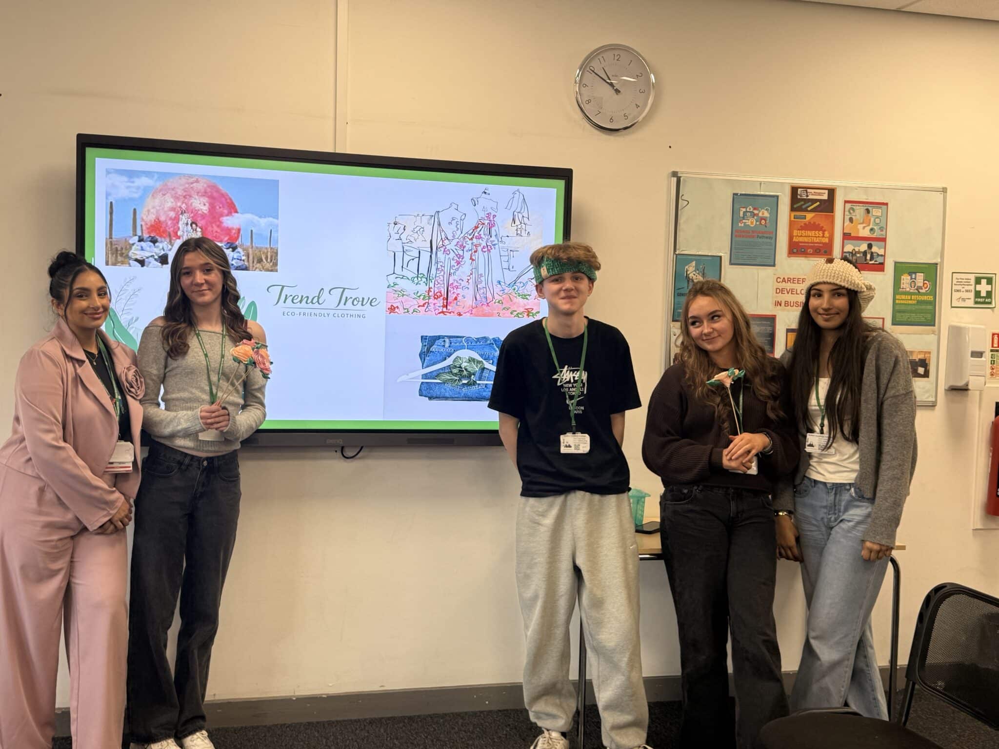 students in front of their presentation