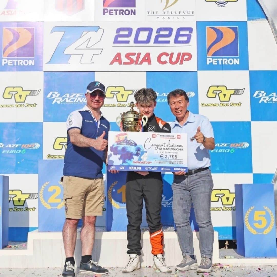 3 men infront of racing back ground