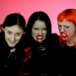 3 zombies against a pink back drop