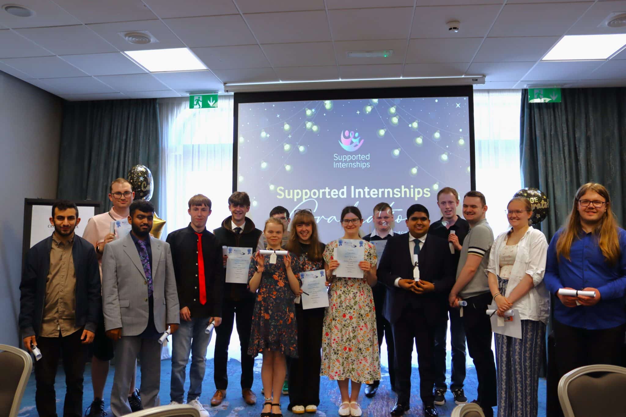 group of students holding certificates