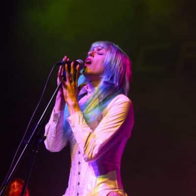student singing into a microphone